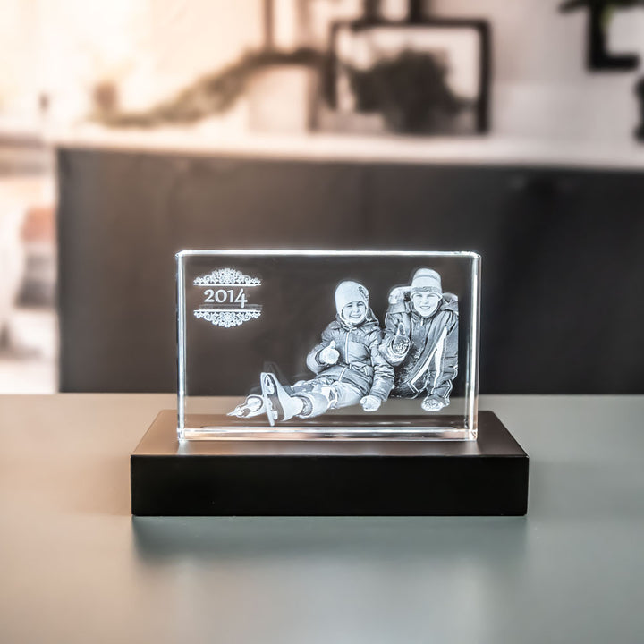 Lying glass block with engraved father and son and year on a luxury light base 9x16 cm