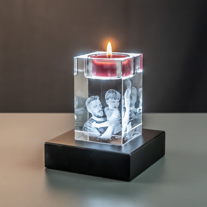 Tea light holder with father and son seen at an angle on a lit luxury light base