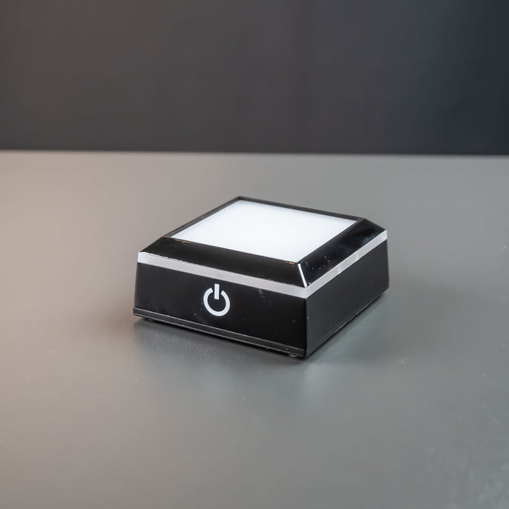 Black square light base 7×7 cm with white light on