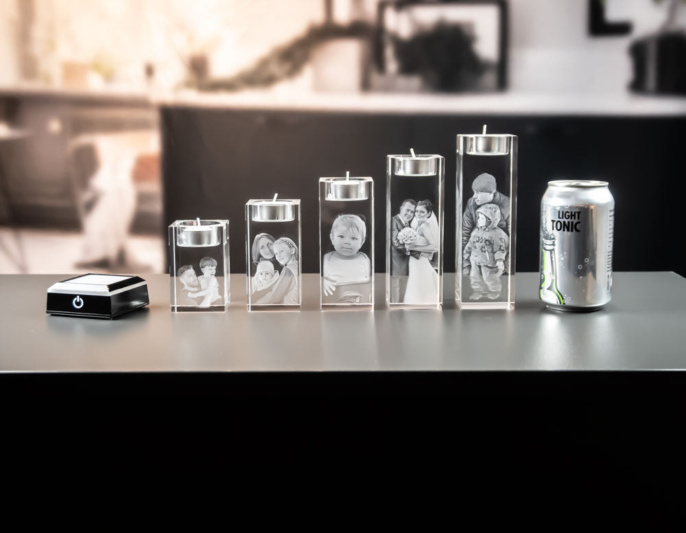All five tea light holders next to a light base and a can for size comparison