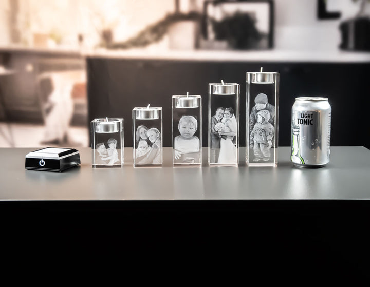All five tea light holders next to a light base and a can for size comparison
