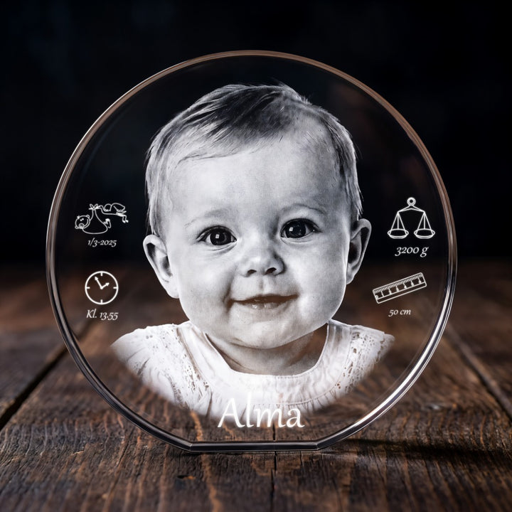 Round crystal glass block with 3D laser-engraved baby, name and birth details with icons