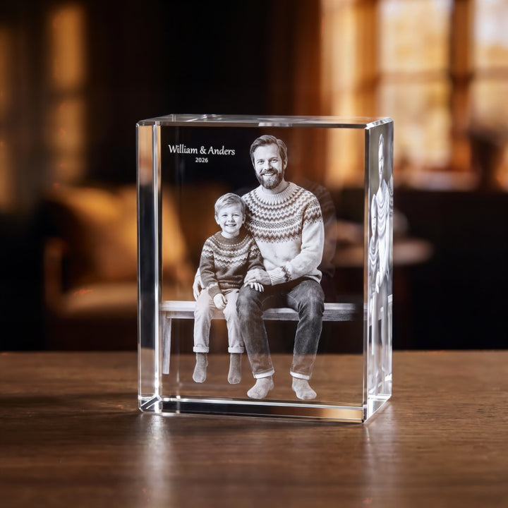 Rectangular crystal glass block with 3D laser-engraved father and son on a bench