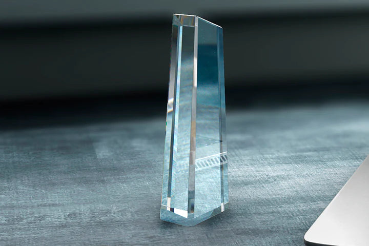 Tall crystal glass obelisk award seen from the side