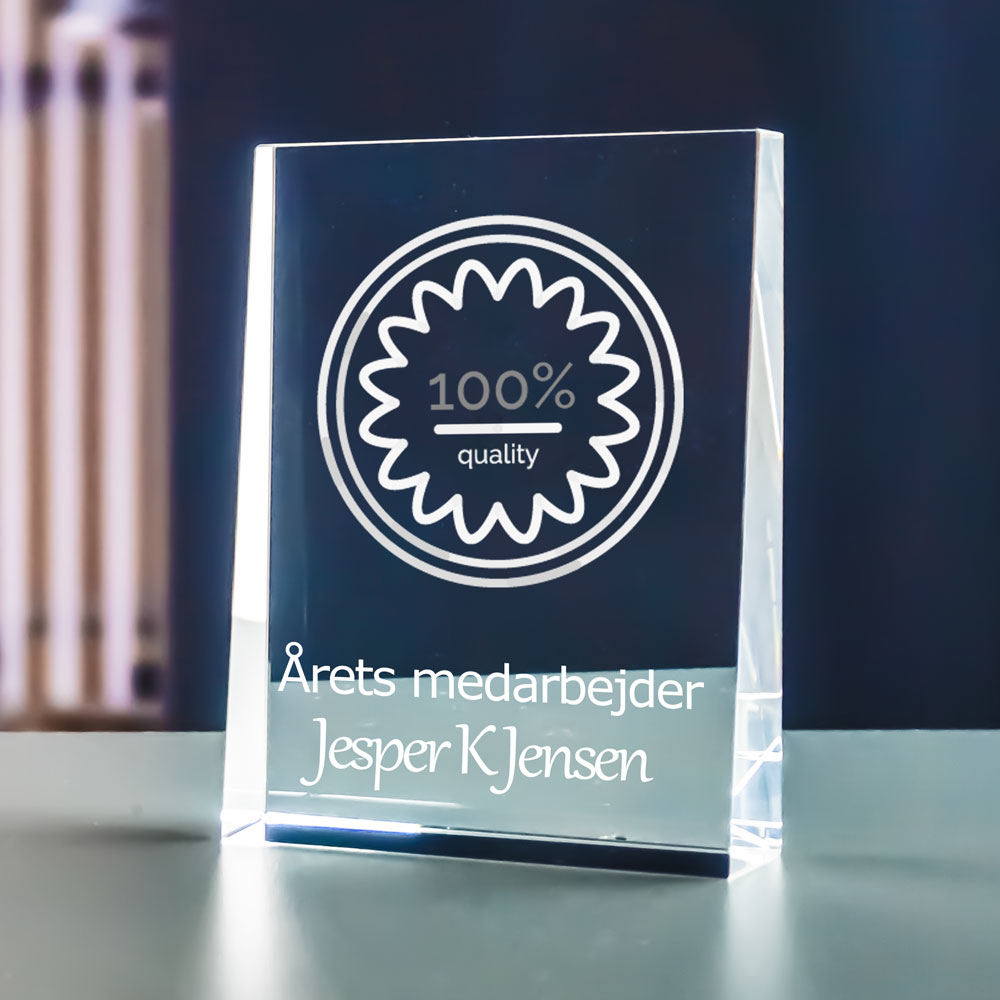 Crystal glass prism award with 2D-engraved logo and the text Employee of the year