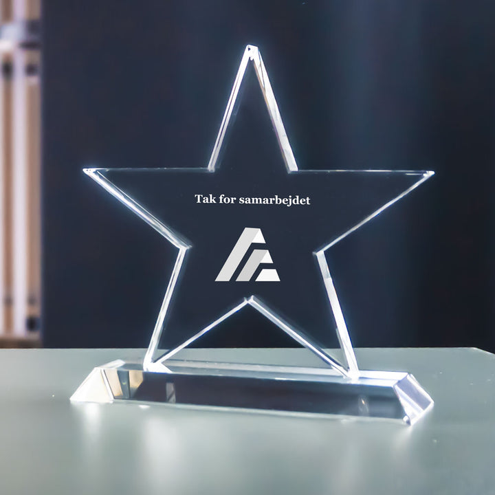 Star-shaped crystal glass award with laser-engraved logo and text