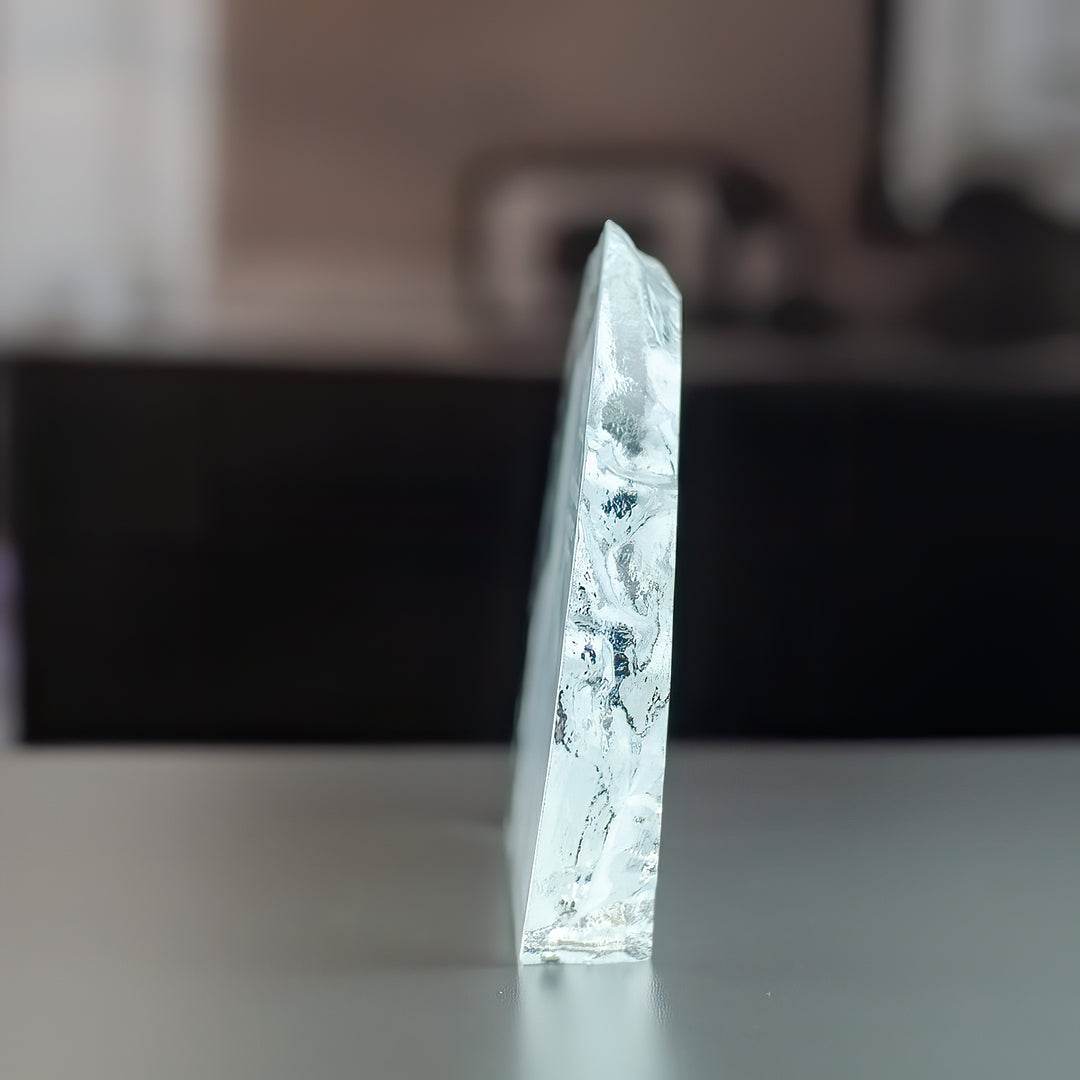 Iceberg-shaped glass block seen from the side, showing the slim depth of about 2.5 cm