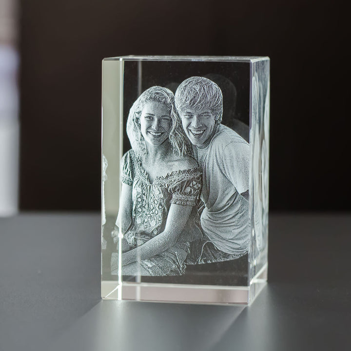 Upright rectangular crystal glass block with 3D laser-engraved smiling couple