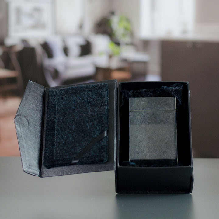 Rectangular glass block in an open black gift box