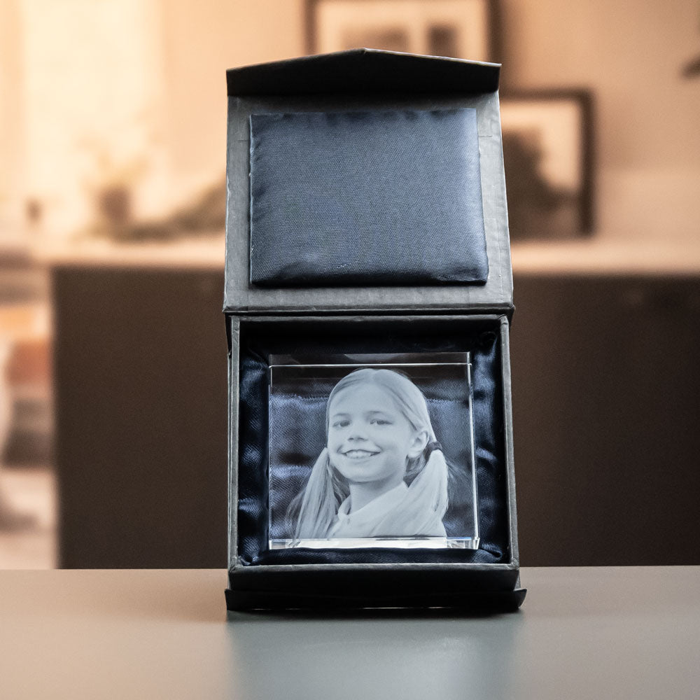 Square glass block with engraved girl in an open black gift box
