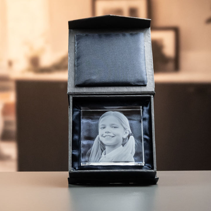 Square glass block with engraved girl in an open black gift box
