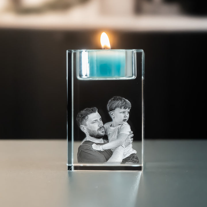 Tea light holder 5x5x8 cm with 3D laser-engraved father and son and a lit blue tea light