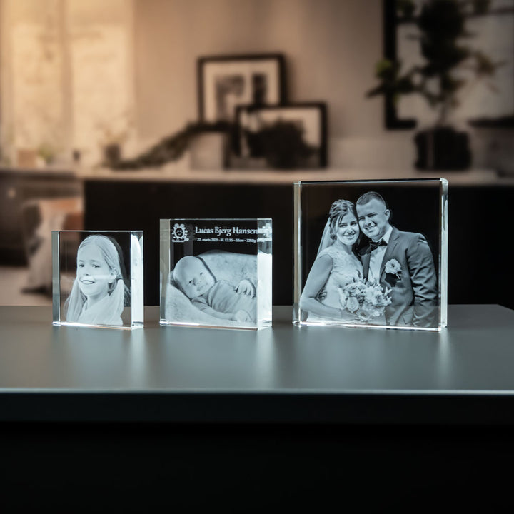 Three square glass blocks in different sizes side by side